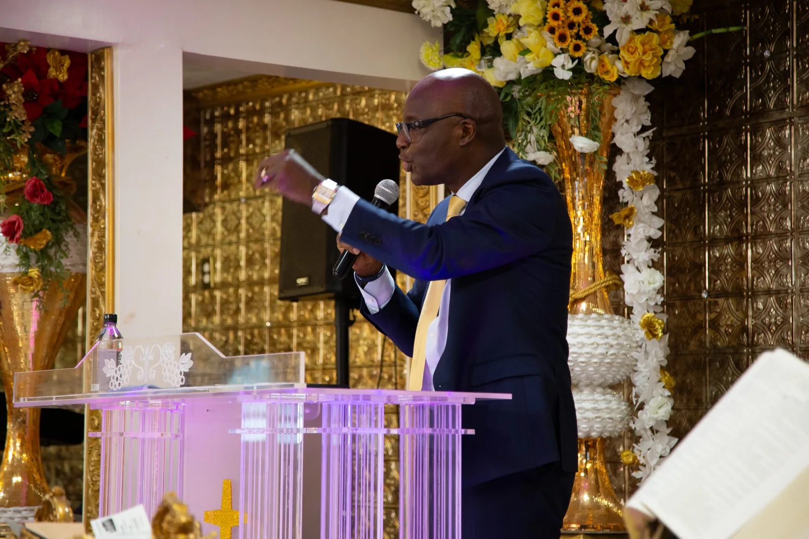 Pastor points across the pulpit during an impassioned message